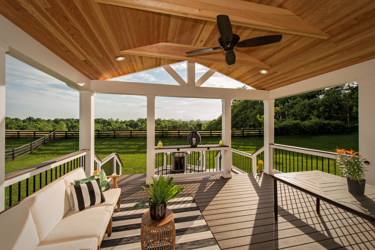 outdoor cocktail sitting area overlooking a backyard